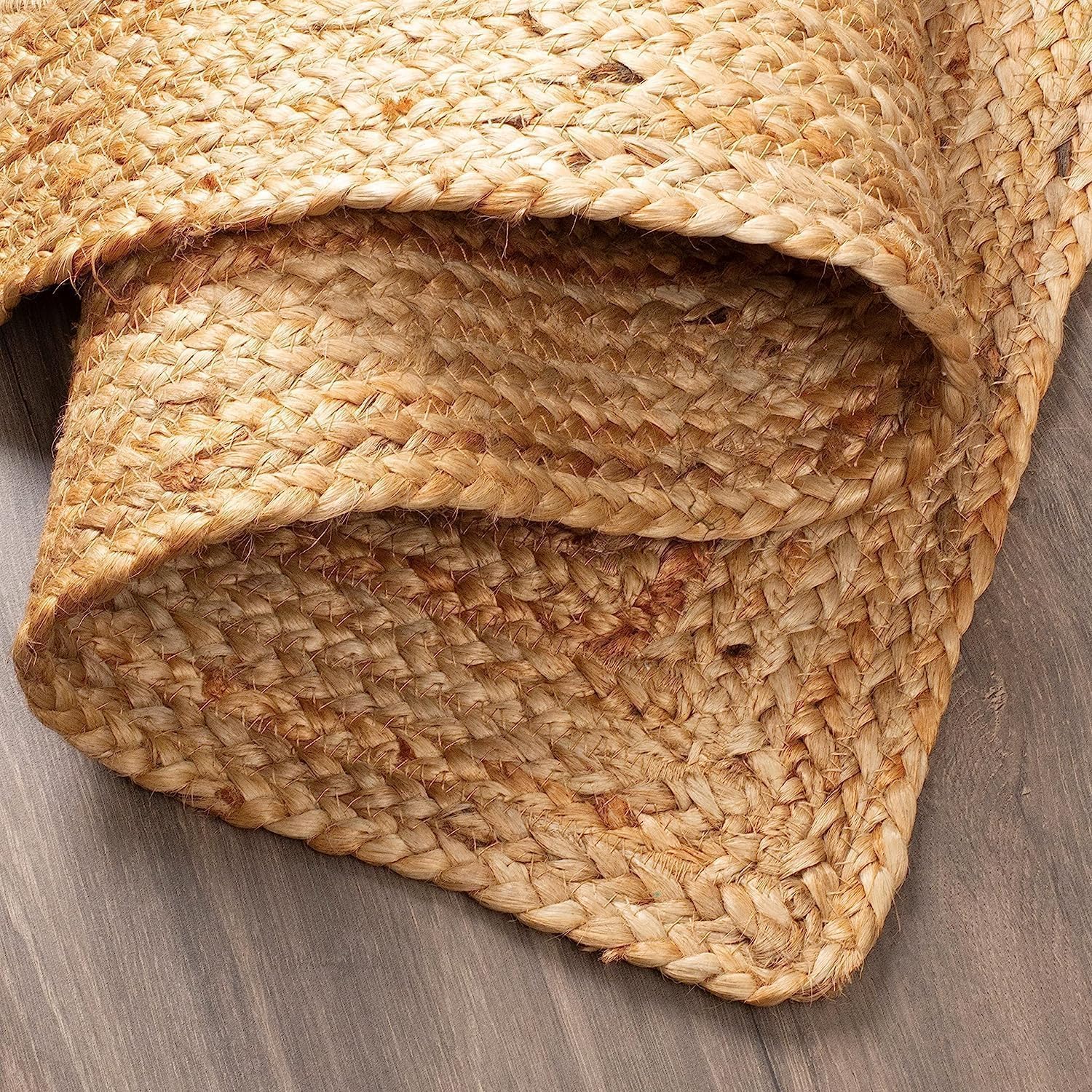 Close-up of a woven jute mat on a wooden surface